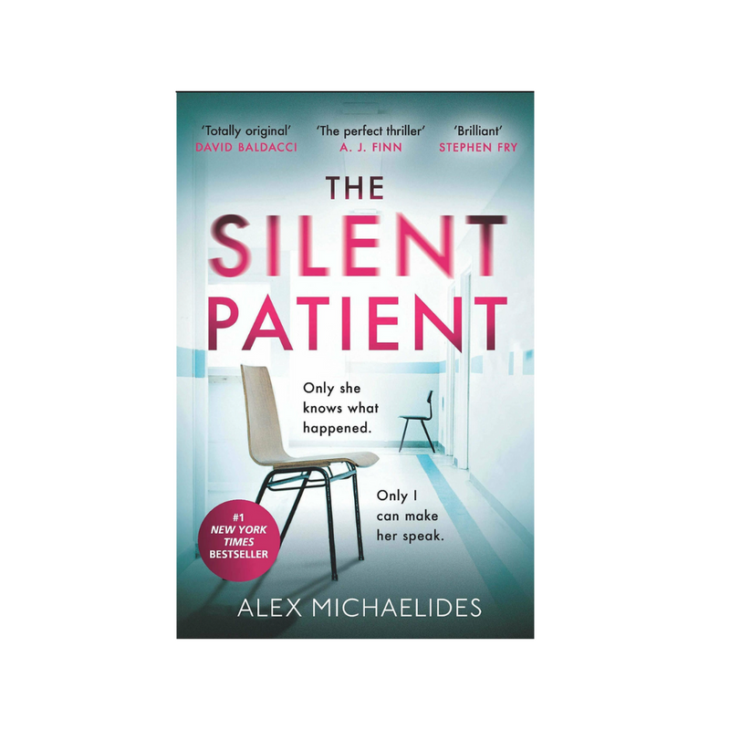 Paperback copy of The Silent Patient novel by Alex Michaelides, featuring a cover with artistic design and book title.