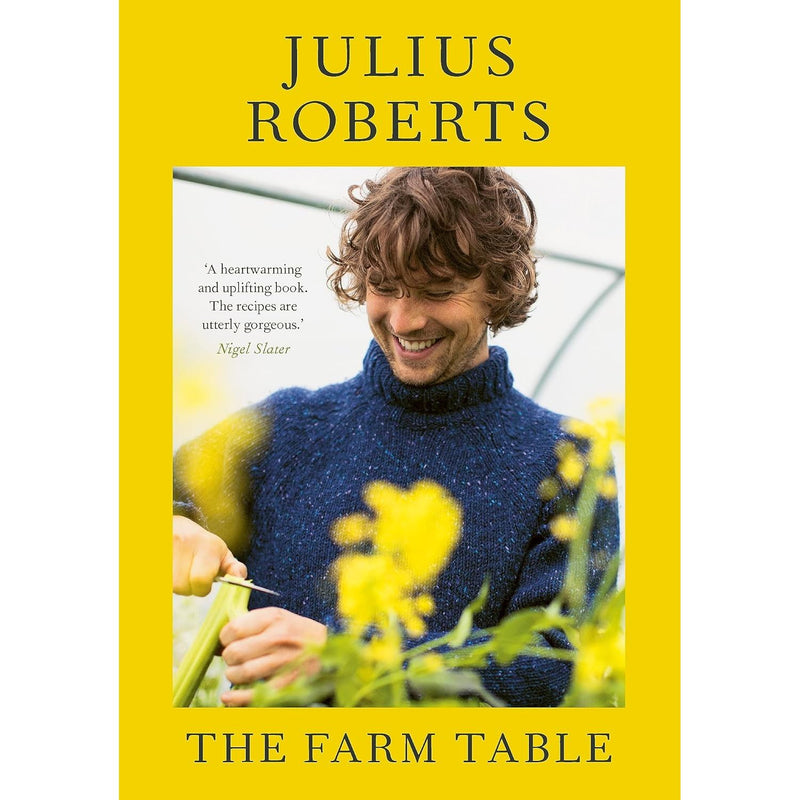 Hardcover of The Farm Table by Julius Roberts, featuring a rustic farm scene with a wooden table and fresh produce.