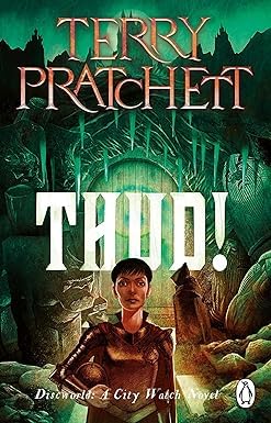 Set of five Discworld paperback books by Terry Pratchett, featuring colorful cover art and classic fantasy fiction.
