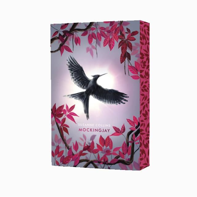 Set of five hardcover The Hunger Games books by Suzanne Collins in the Deluxe Collection, featuring iconic fictional covers.