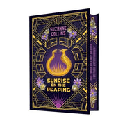 Five hardcover books from Suzanne Collins' The Hunger Games Deluxe Collection set, featuring iconic fictional characters and covers.