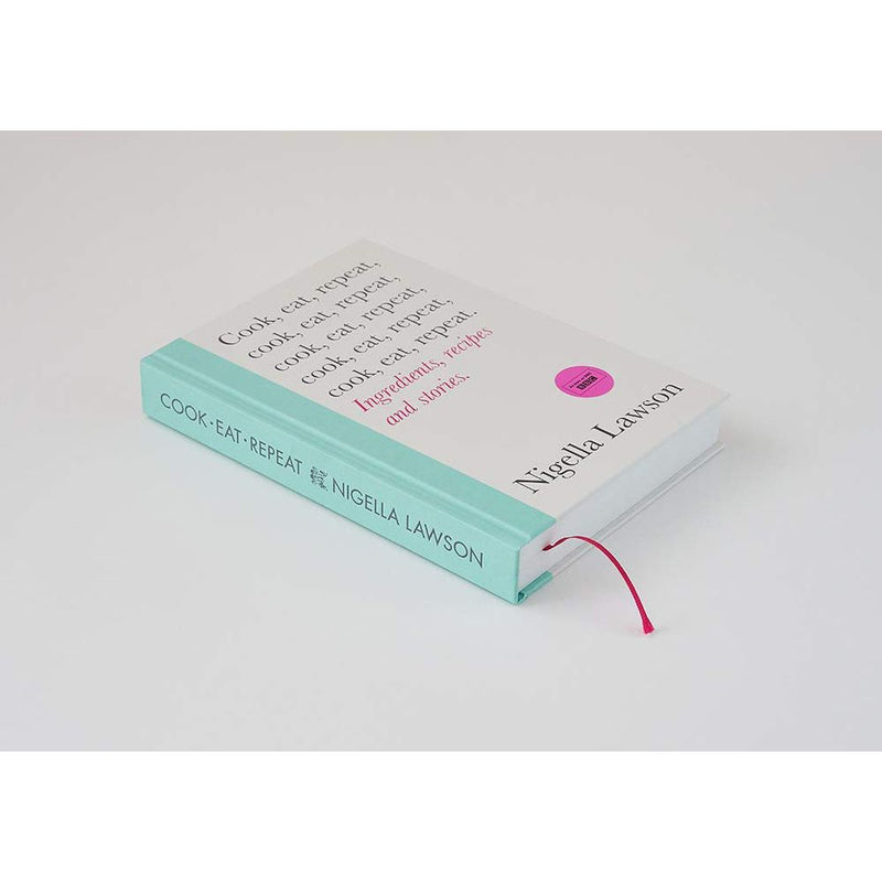 Hardcover of "Cook, Eat, Repeat" by Nigella Lawson featuring a colorful food recipe book with a rustic table background.