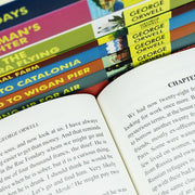 Set of nine classic editions of George Orwell's works, including Homage to Catalonia and Burmese Days, featuring distinctive cover art.