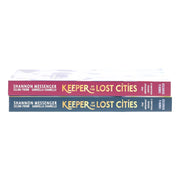 Two Keeper of the Lost Cities graphic novels by Shannon Messenger in paperback, featuring colorful cover art and young adult fantasy themes.