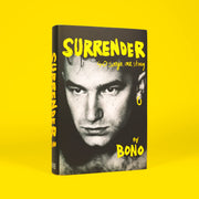 Hardcover copy of Bono's autobiography "Surrender," featuring his story and 40 songs, published by Hutchinson Heinemann.