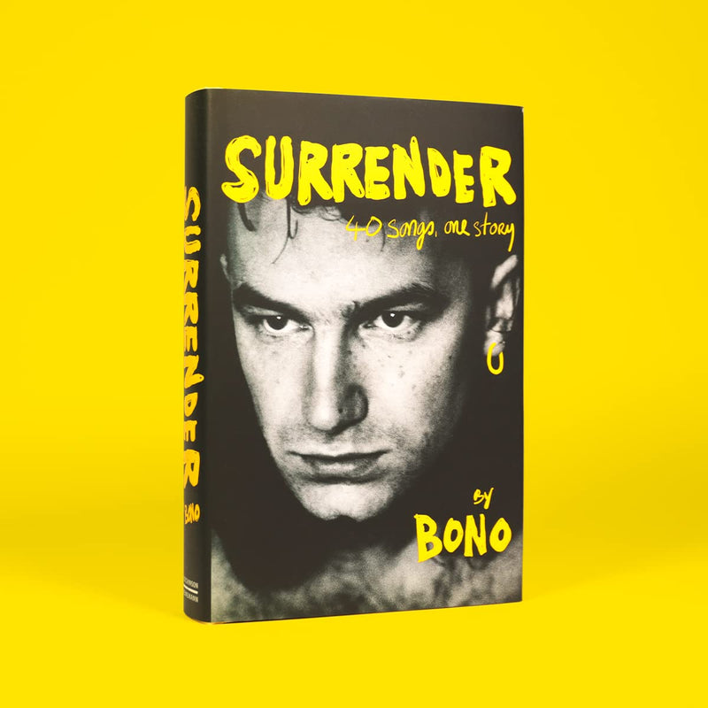 Hardcover copy of Bono's autobiography "Surrender," featuring his story and 40 songs, published by Hutchinson Heinemann.
