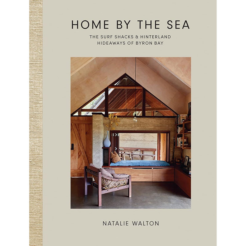 Cover image of "Home by the Sea" book featuring coastal home interiors and scenic views of Byron Bay.