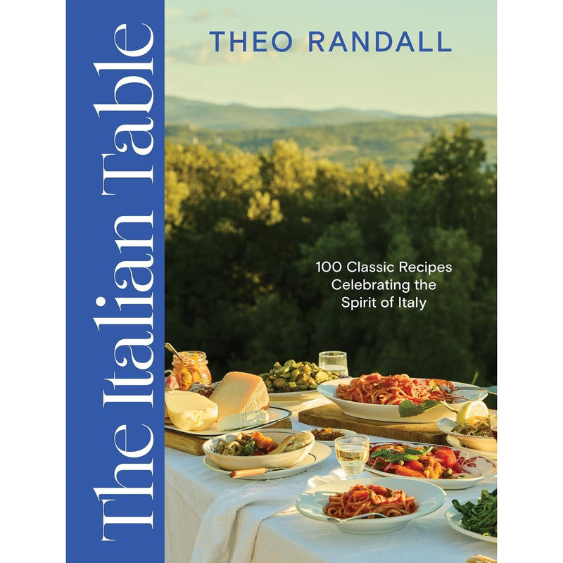 Open paperback of "The Italian Table" cookbook by Quadrille Publishing, showing colorful recipe pages and Italian culinary illustrations.