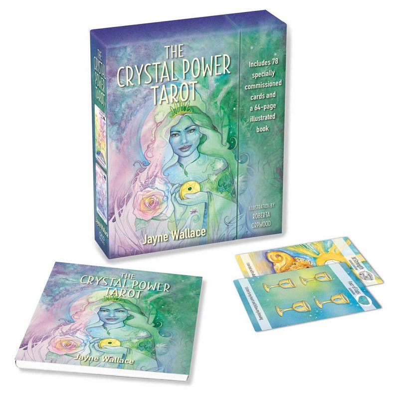 Close-up of the Crystal Power Tarot deck by Jayne Wallace, featuring a colorful 78-card tarot card deck in a paperback edition.