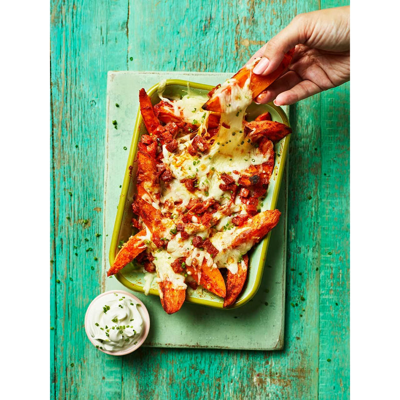 Cover of The Ultimate Air Fryer Cookbook by Clare Andrews, featuring vibrant food images and the book title.