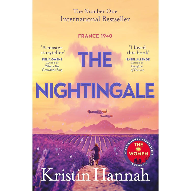 Set of 12 paperback Kristin Hannah fiction books in a collection, showcasing colorful covers and spines in a pan view.