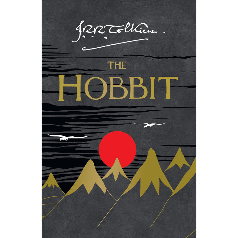 Paperback of The Hobbit by J. R. R. Tolkien, fantasy novel with illustrated cover featuring a hobbit and mountain scene.
