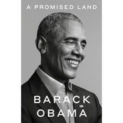 Paperback of "A Promised Land" by Barack Obama, a political memoir with a cover featuring the title and author's name.