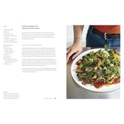 Hardcover of "Mezcla: Recipes to Excite" cookbook by Ixta Belfrage, featuring colorful dish photos on the cover.