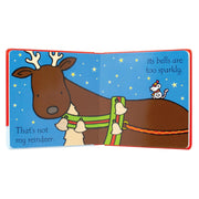 Open page of "That's not my reindeer" baby and toddler Christmas book by Fiona Watt, featuring colorful illustrations of a reindeer.