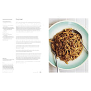 Hardcover of "Mezcla: Recipes to Excite" cookbook by Ixta Belfrage, featuring colorful dish images on the cover.