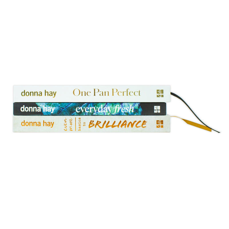 Donna Hay collection of three cookbooks including One Pan Perfect, Basics to Brilliance, and Everyday Fresh, displayed together.