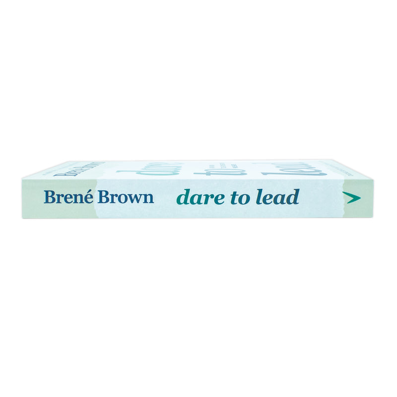 Paperback book titled "Dare to Lead" by Brene Brown, featuring a cover with bold text and author photo on the Random House Publishing Group edition.