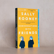 Paperback of Conversations With Friends by Sally Rooney, a fiction novel published by Faber & Faber, featuring the book cover.