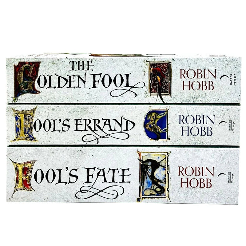 Three paperback books from Robin Hobb's Tawny Man Trilogy collection by Harper Voyager, featuring fantasy fiction covers.