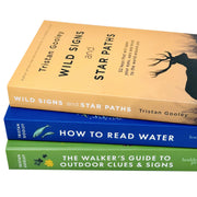 Set of three paperback books by Tristan Gooley on outdoor clues, water reading, wild signs, and star paths, in a collection.