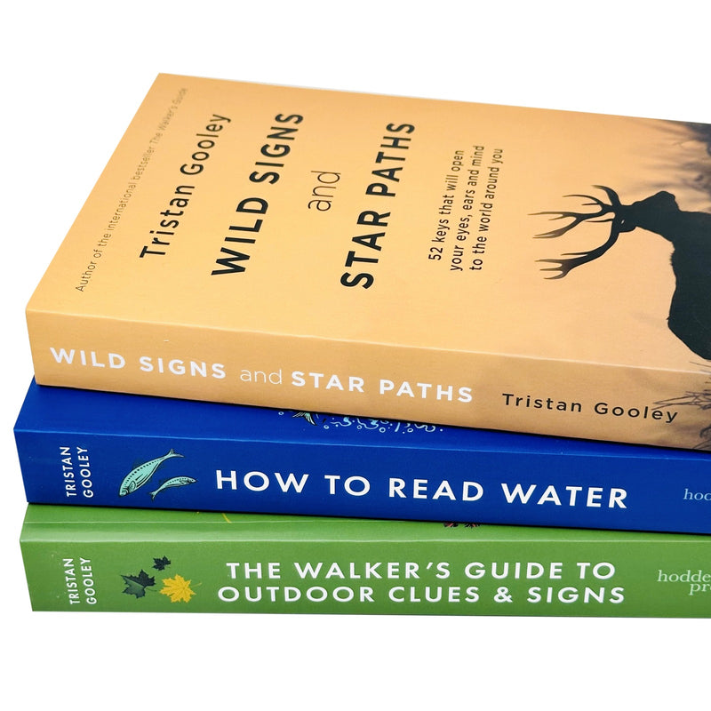 Set of three paperback books by Tristan Gooley on outdoor clues, water reading, wild signs, and star paths, in a collection.