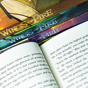 Set of five Wings of Fire series books by Tui T. Sutherland, featuring colorful dragon illustrations on the covers.