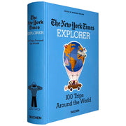Hardcover book titled "The New York Times Explorer 100 Trips Around The World" by Taschen, showing a colorful cover with travel images.