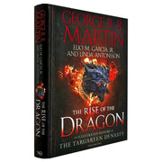 Hardback book titled "The Rise of the Dragon" by George R. R. Martin and Elio M. García Jr, featuring an illustrated history of Targaryen dynasty.