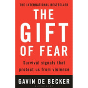 Set of two paperback non-fiction books, "The Gift of Fear" and "The Ultimate Edge" by Gavin de Becker and Dale Carnegie, on a light background.