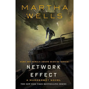Seven paperback books from Martha Wells' The Murderbot Diaries collection, featuring sci-fi fiction by Tor Books.