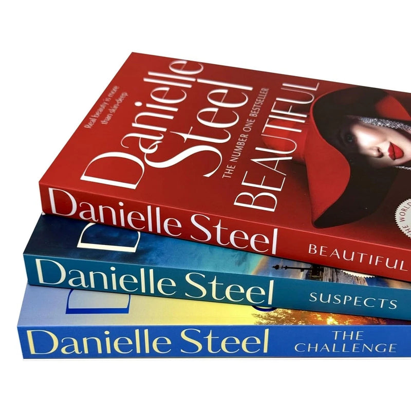 Set of three Danielle Steel books—Suspects, Beautiful, and The Challenge—shown in a sleek black pan for display or storage.