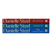 Three Danielle Steel books from the Suspects, Beautiful, and The Challenge collection set, displayed in a pan-shaped arrangement.