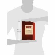 Hardcover of "Whisky: The Manual" by Dave Broom, featuring the book cover with title and author, about enjoying whisky in all forms.