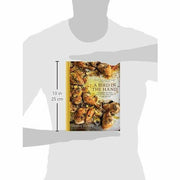 Hardcover book cover of "A Bird In The Hand" by Diana Henry, featuring chicken recipes for everyday meals, published by Mitchell Beazley.
