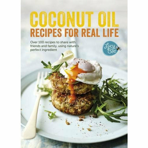 Hardcover book titled "Coconut Oil: Recipes for Real Life" by Lucy Bee, featuring over 100 gluten-free coconut oil recipes.