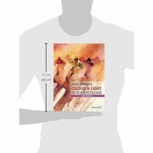 Paperback copy of "How to Paint Colour & Light in Watercolour" by Jean Haines, showing the book cover with colorful artwork.