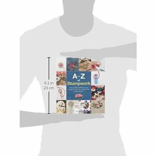 Open paperback of "Search Press Classics: A-Z Of Stumpwork" needlecraft book by Country Bumpkin Publications, featuring colorful stitch illustrations.