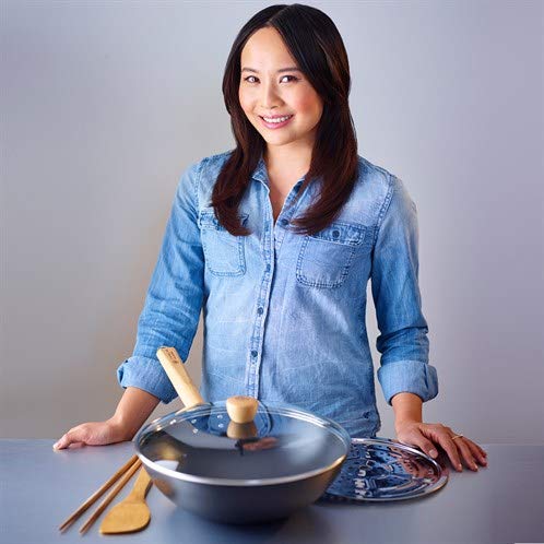 Paperback cookbook "Eat Clean: Wok Yourself to Health" by Ching-He Huang featuring Asian wok recipes and healthy cooking tips.