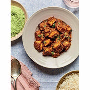 Hardcover copy of Nadiya Hussain's "Nadiya's Family Favourites" cookbook featuring easy, beautiful recipes for everyday cooking.