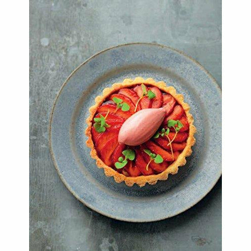 Hardcover book titled "Tom Kerridge’s Best Ever Dishes" featuring over 100 classic recipes by Tom Kerridge, published by Bloomsbury.