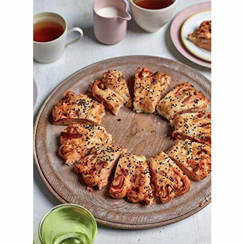 Nadiya Hussain's "Family Favourites" hardcover cookbook featuring easy, beautiful recipes for everyday cooking.