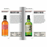 Hardcover copy of "Whisky: The Manual" by Dave Broom, a non-fiction guide to enjoying whisky in various forms, published by Mitchell Beazley.
