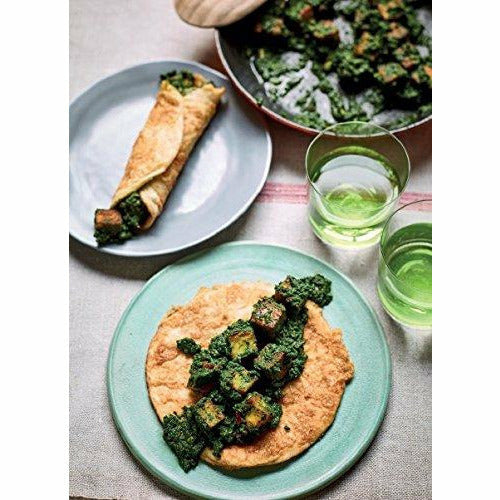 Hardcover recipe book titled "Nadiya's Family Favourites" by Nadiya Hussain, featuring easy, beautiful family-friendly recipes.