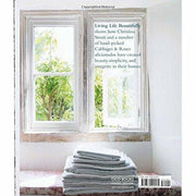 Hardcover book titled Living Life Beautifully by Christina Strutt, with Nancy Alsop, featuring elegant design and inspiring content.