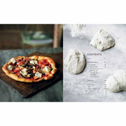 Hardcover book titled "Franco Manca: Artisan Pizza to Make Perfectly at Home" by Giuseppe Mascoli and Bridget Hugo.