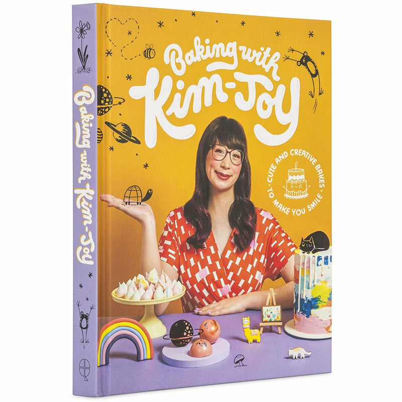 Open hardcover book "Baking With Kim-Joy" featuring colorful baked goods and creative cake designs by Kim-Joy.