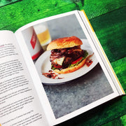 Hardcover book "Original Flava" by Craig McAnuff featuring Caribbean recipes, with colorful cover design and culinary imagery.