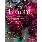 Hardcover book titled "In Bloom" by Clare Nolan, featuring vibrant flower arrangements on the cover.