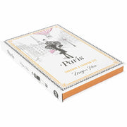 Illustrated hardcover travel guide "Paris: Through a Fashion Eye" by Megan Hess, featuring fashion-inspired Paris landmarks and scenes.